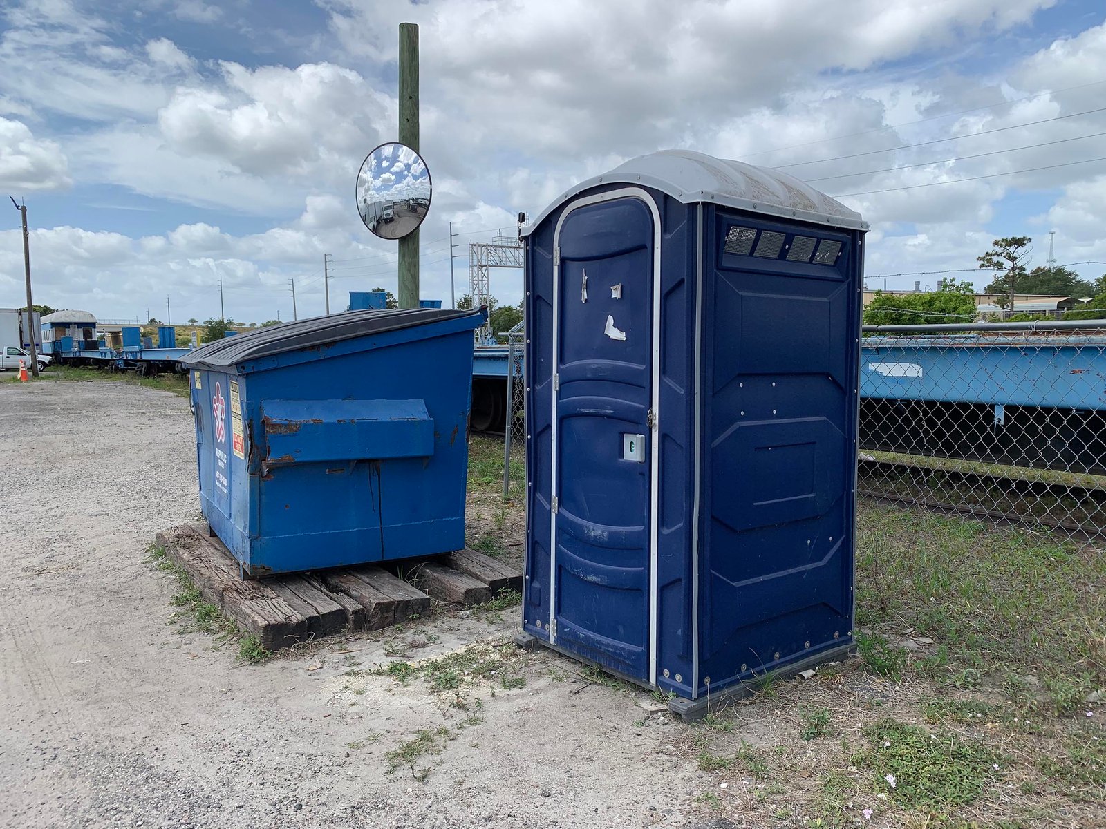 Portable toilet on side of the way